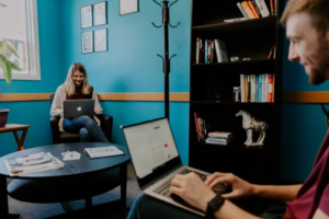 Two people on a laptop